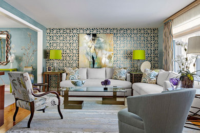 Example of a large transitional open concept light wood floor and brown floor living room design in New York with blue walls and no fireplace