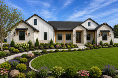 Inspiration for a large country white one-story mixed siding and board and batten exterior home remodel in Boise with a shingle roof and a black roof