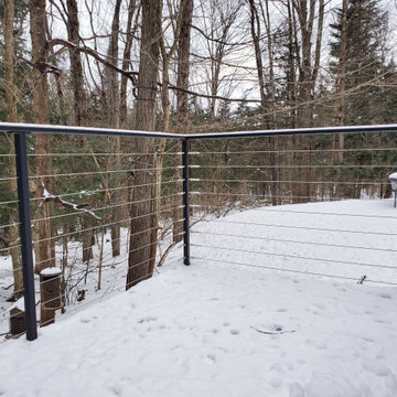 Black metal post cable railing project in Lanaudière, Quebec