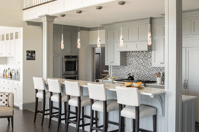 Design ideas for a transitional single-wall open plan kitchen in Portland Maine with shaker cabinets, grey cabinets, multi-coloured splashback, mosaic tile splashback, stainless steel appliances, dark hardwood floors, with island and granite benchtops.