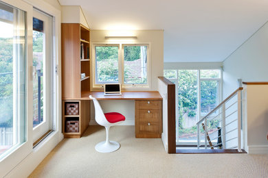 Photo of a transitional study room in Canberra - Queanbeyan with white walls, carpet, no fireplace, a built-in desk and beige floor.