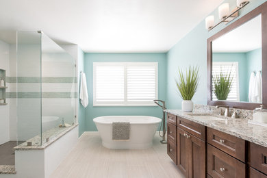 Example of a large transitional master cement tile floor bathroom design in Denver with blue walls, a drop-in sink and brown cabinets