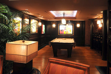 Inspiration for a large timeless medium tone wood floor and brown floor basement remodel in Indianapolis with brown walls
