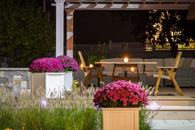 Patio - mid-sized modern backyard patio idea in Boston with decking and a pergola