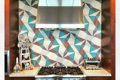Inspiration for a transitional kitchen remodel in Austin with multicolored backsplash and white countertops