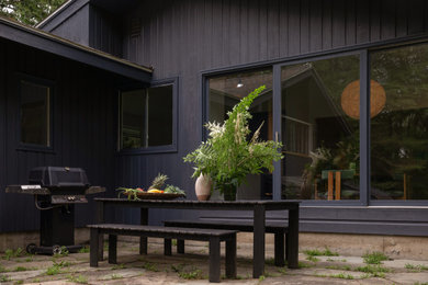 Mid-century modern patio photo in Boston