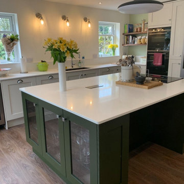 Painted shaker kitchen in off white and mid tone forest green