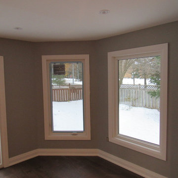 Three panel Solid core doors with modern casing and baseboards + window casing