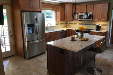 Mid-sized transitional l-shaped porcelain tile and multicolored floor eat-in kitchen photo in Other with an undermount sink, recessed-panel cabinets, medium tone wood cabinets, quartz countertops, beige backsplash, porcelain backsplash, stainless steel appliances and an island