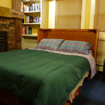 Cabinet bed- opened. Folds up into cabinet. In cherry hardwood.