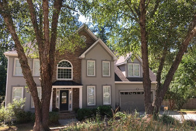This is an example of a large traditional porch design in Atlanta.