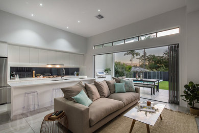 Mid-sized contemporary open concept living room in Brisbane with white walls, porcelain floors, a wall-mounted tv and white floor.