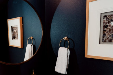 Example of a transitional powder room design in Austin