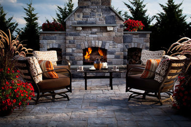 Patio - mid-sized transitional backyard stamped concrete patio idea in Providence with a fire pit and no cover