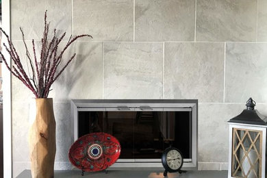 Inspiration for a contemporary brown floor living room remodel in Orange County with a standard fireplace and a tile fireplace