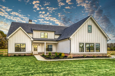 Example of a farmhouse exterior home design in Other