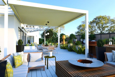 Design ideas for a large contemporary backyard deck in Marseille with a fire feature and a pergola.