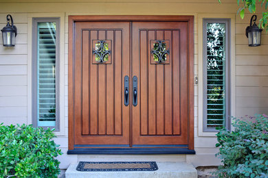 Photo of a traditional front door in Sacramento with a double front door and a medium wood front door.