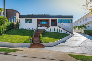 Large mid-century modern multicolored two-story house exterior photo in Los Angeles
