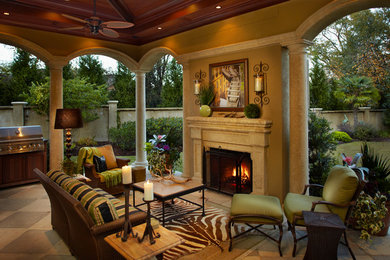 Inspiration for a mid-sized timeless tile back porch remodel in Other with a fire pit