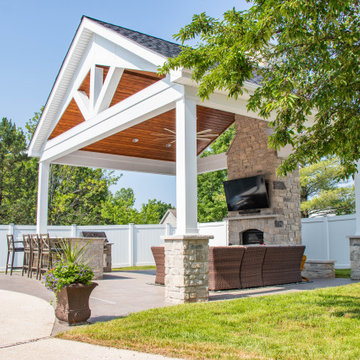 Open Gable Pool House with Fireplace and Grilling Area
