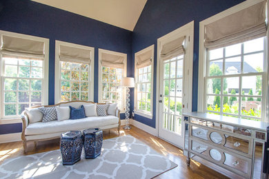 Example of an eclectic formal and open concept light wood floor living room design in Nashville with blue walls