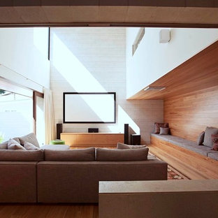 Design ideas for an expansive contemporary enclosed home cinema in Brisbane with grey walls, travertine flooring and a projector screen.