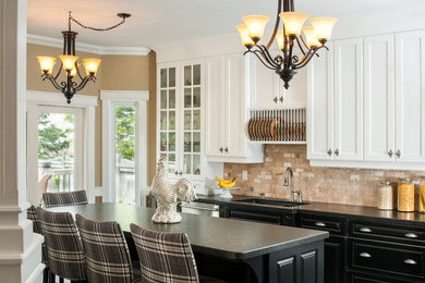 Inspiration for a timeless kitchen remodel in Toronto with an undermount sink, glass-front cabinets, white cabinets and beige backsplash