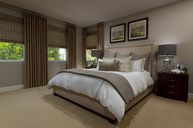 Photo of a large transitional master bedroom in Orange County with beige walls, carpet and no fireplace.