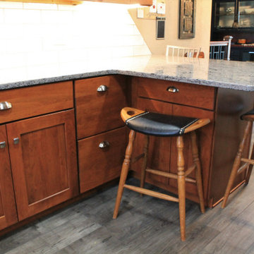 Omega Cabinetry, Benson door, Cherry wood, Nutmeg stain.