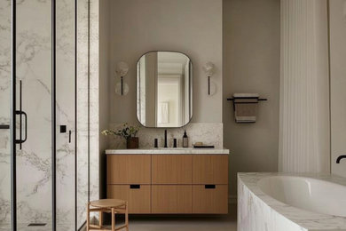 Design ideas for a large modern bathroom in London with marble tiles and a built in vanity unit.