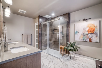 Bathroom - mid-sized contemporary master brown tile and porcelain tile porcelain tile and multicolored floor bathroom idea in Ottawa with flat-panel cabinets, medium tone wood cabinets, a two-piece toilet, gray walls, an undermount sink, quartz countertops and brown countertops