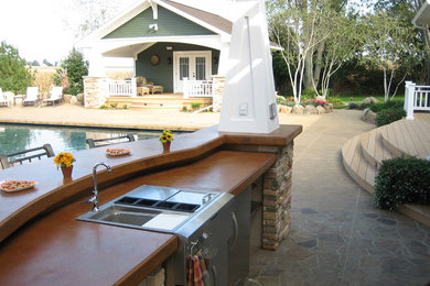 Hot tub - large transitional backyard stone and rectangular natural hot tub idea in Cedar Rapids