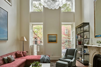Mid-sized transitional formal and enclosed dark wood floor and brown floor living room photo in New York with beige walls, a standard fireplace, a stone fireplace and no tv