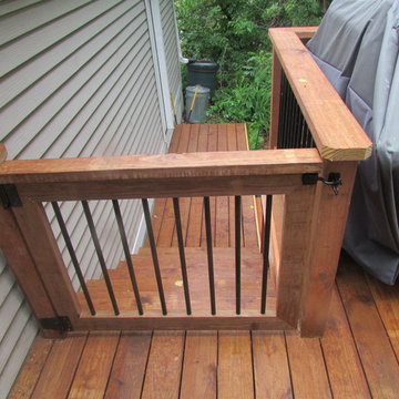 Cedar toned pressure treated deck with aluminum balusters 2