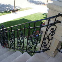 Solid stone stairs with ornamental iron railing - Products