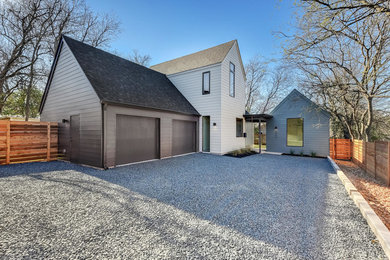 Example of a small trendy multicolored two-story concrete fiberboard gable roof design in Austin