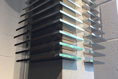 This is an example of a large modern staircase in Other.