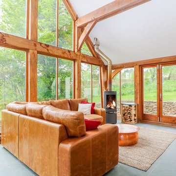 Stunning conservatory with natural materials and log burner
