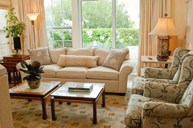 Design ideas for a traditional formal living room in San Francisco with beige walls and light hardwood floors.