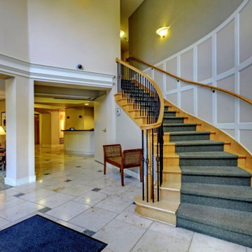 Custom Circular Hard Maple Staircase with Iron Balusters
