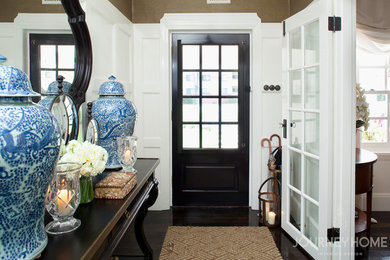 Small traditional entryway in Canberra - Queanbeyan with white walls, dark hardwood floors, a single front door and a black front door.