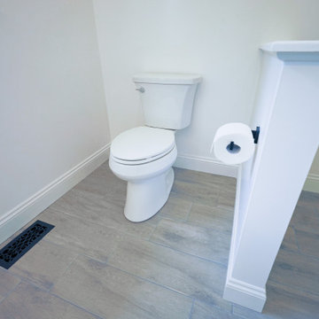 Relocated bathroom and new half wall installation