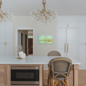Château Charm: French-Inspired Kitchen Renovation with Plaster Hood Blue Stove a