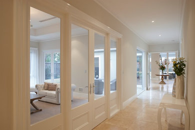 Inspiration for a large traditional entry hall in Perth with terra-cotta floors and a double front door.