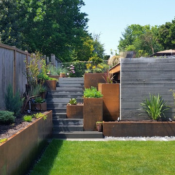 Hardscapes: stairway, fence, retaining wall. corten steel planters