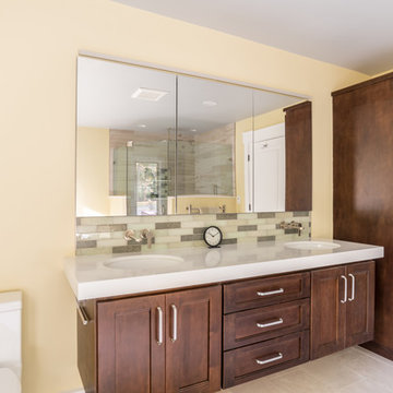 Brown Cabinets with Floating Faucets