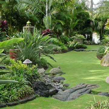 Bali garden with 9 hole putt-putt golf course and stone drainage channels