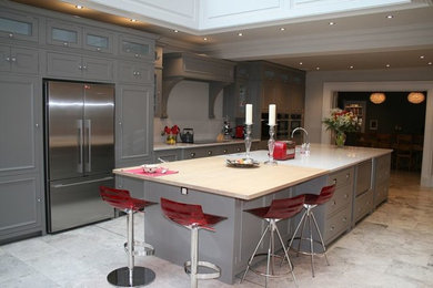 Inspiration for a contemporary galley open plan kitchen in Other with grey cabinets and with island.