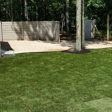 Backyard Makeover Installing Sod, Privacy Hedge, Flower Garden, Gravel Driveway